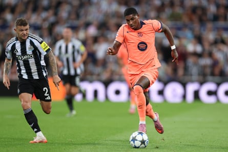 Marcus Rashford of Barcelona surges away from Kieran Trippier of Newcastle United.
