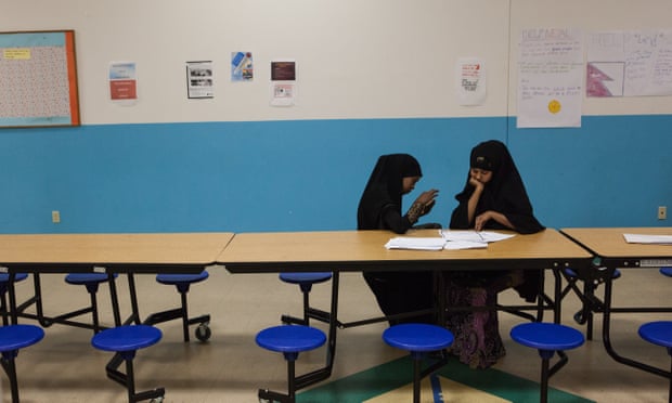 Two Somali girls study during their lunch break at Linclon International High School, one of a number of charter schools.