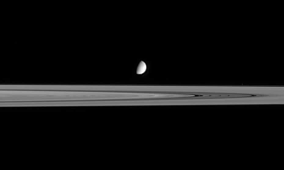 Dark journeys into space … Saturn’s B Ring and moon Enceladus.