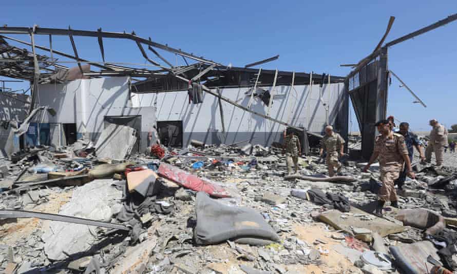 Military personnel check the rubble of a destroyed detention center in Tripoli, Libya, 3 July 2019.