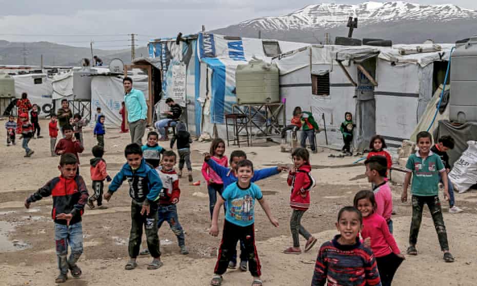 Syrian refugee children in front of tents at Al Faydah refugee camps, near Zahleh in the Bekaa Valley, Lebanon, 12 March 2020.