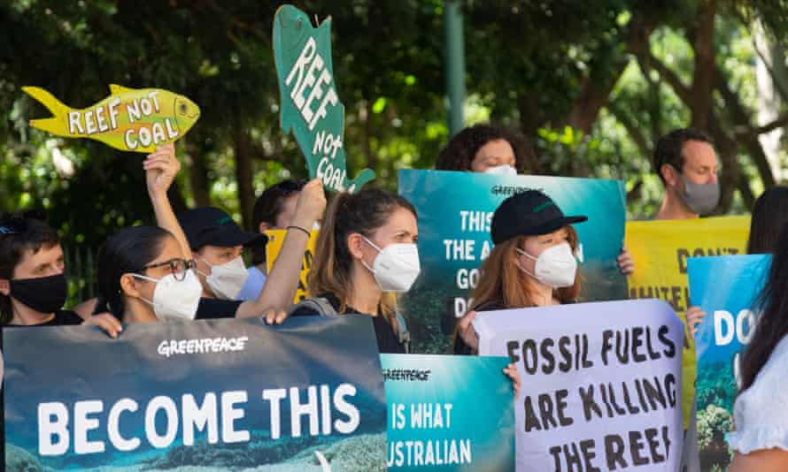 Greenpeace protesters outside government offices in Brisbane where a Unesco monitoring mission is being briefed on the health of the Great Barrier Reef before travelling to different parts of it