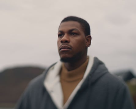 Portrait of John Boyega against a blurry background