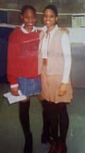 Two teenage girls standing together, one with her arm around the other