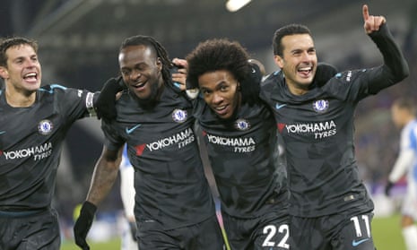 Pedro, right, celebrates scoring Chelsea’s third goal against Huddersfield Town with his team-mates.
