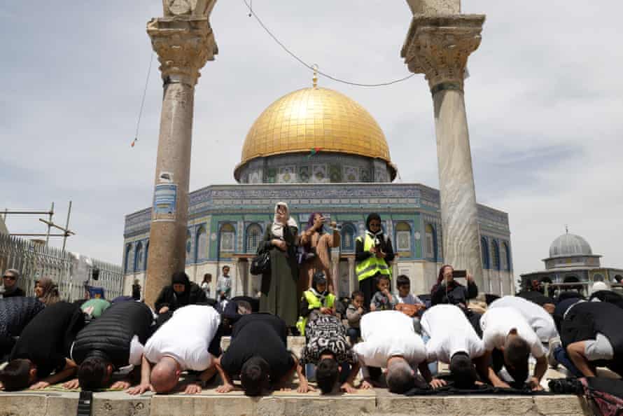 Palestinians perform Friday prayers, the third of the Muslim holy month of Ramadan, at the Al-Aqsa Mosque complex.