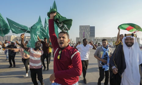 Fans of Saudi Arabia celebrate their team’s 2-1 victory over Argentina outside the Lusail Stadium in Qatar on Tuesday.