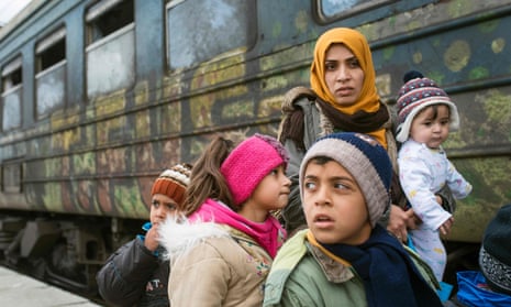Syrian refugees board a train heading to Serbia from the Macedonian-Greek border in February 2016.