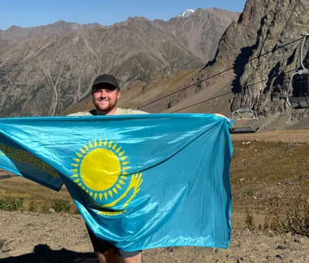 Wales fan John McAllister with a Kazakhstan flag.