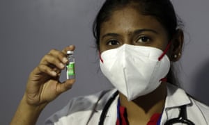 A health worker shows Covid-19 vaccine in Mumbai, India.