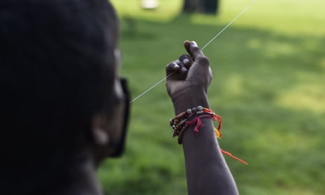 A close-up of a boy holding a kite string