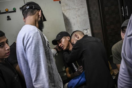 Palestinian relatives at the morgue of the Jenin hospital prior to the funeral of a man killed during an overnight incursion and clashes with the Israeli army in the Jenin refugee camp.