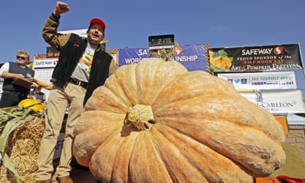 Leonardo Urena cheers next to huge pumpkin