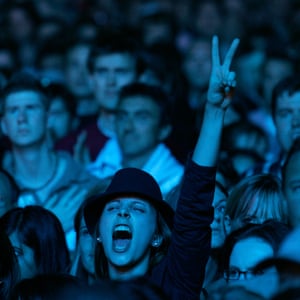 A woman in the crowd cheers The Who at the Live 8 concert in Hyde Park, London, in 2005.