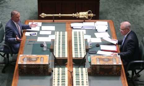 Australian prime minister Scott Morrison talks to Labor leader Anthony Albanese in parliament