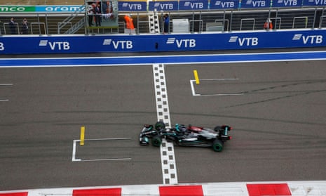Mercedes’ Lewis Hamilton crosses the line to win the race.