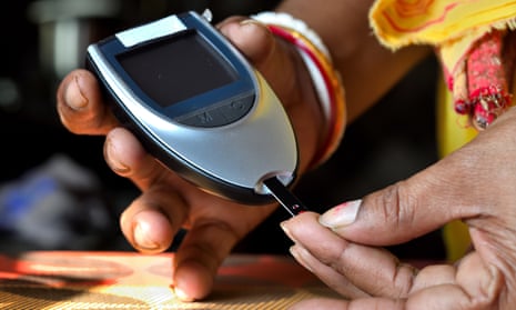 A person with diabetes checking their blood sugar
