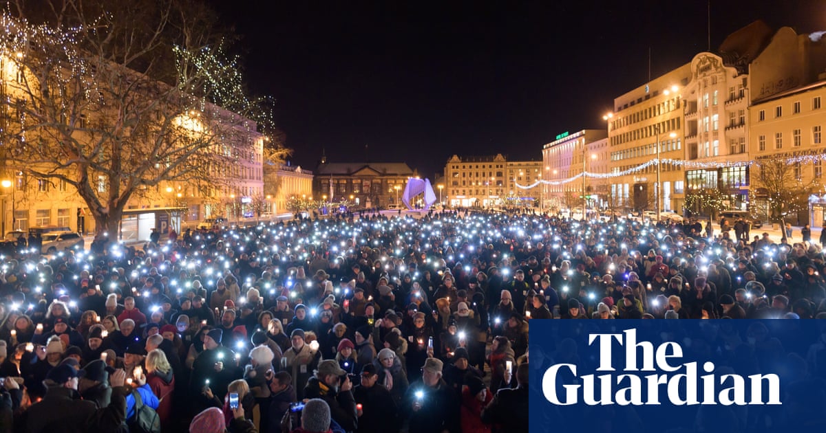 'A tragic moment': thousands gather across Poland to mourn Gdańsk mayor