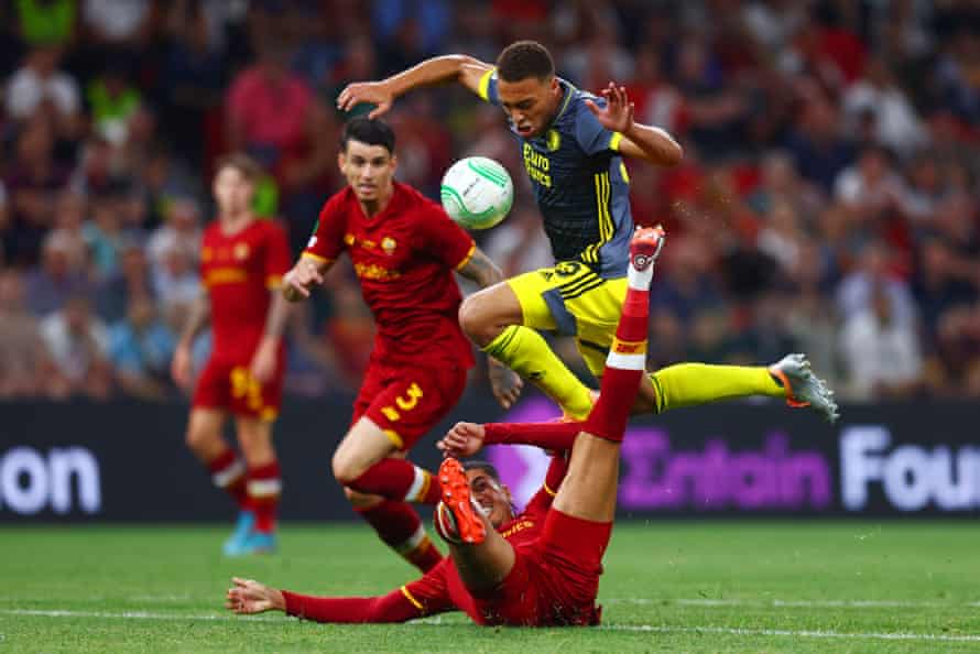 Cyriel Dessers of Feyenoord hurdles the challenge of Roma’s Chris Smalling.