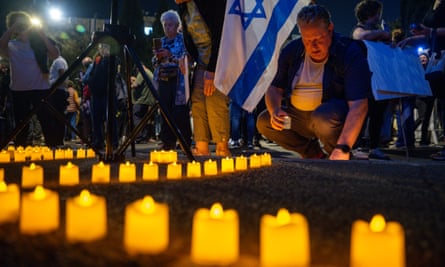Candles are lit outside the Knesset in Jerusalem in a protest against Benjamin Netanyahu on 7 November 2023, one month on from the 7 October attacks.