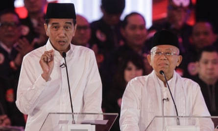 Indonesian president Joko Widodo, left, and running mate Ma’ruf Amin speak at the first televised debate in Jakarta on Thursday.