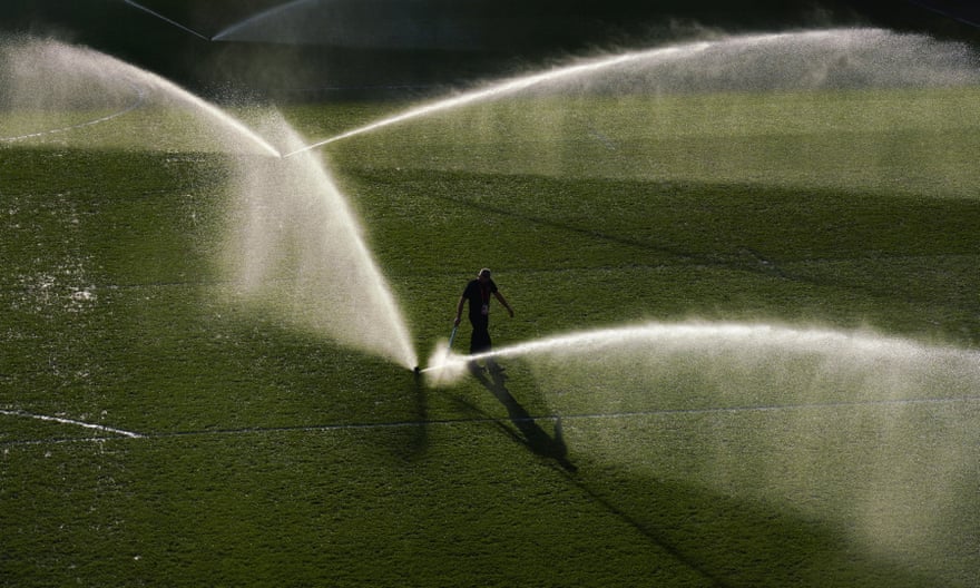 Watering the pitch in Brentford, west London.