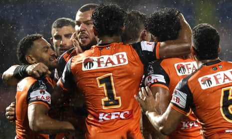 Tigers players celebrate during the round nine NRL match between Penrith Panthers and Wests Tigers at Carrington Park
