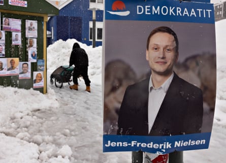 A campaign poster of Jens-Frederik Nielsen of the Demokraatit party for Greenland’s legislative elections hangs in the center of Nuuk, Greenland, April 2021.