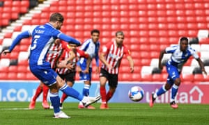 Luke Leahy of Bristol Rovers opens the scoring from the penalty spot.