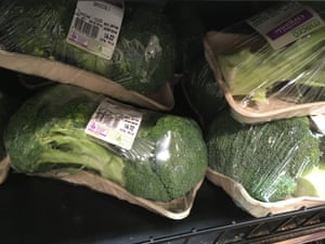 Shrink-wrapped broccoli on a card tray