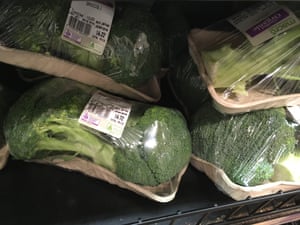 Shrink-wrapped broccoli on a card tray 