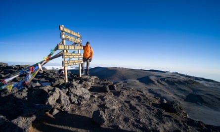 Climber at the summit of Kilimanjaro