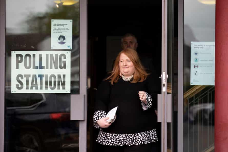 Naomi Long, justice minister in Northern Ireland and leader of the Alliance party, leaves a polling station at St Colmcilles parish hall in East Belfast after voting today.