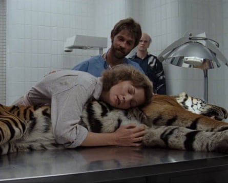 Woman hugging a dead tiger