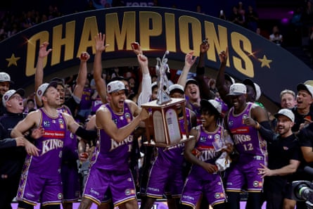 The Sydney Kings hold the NBL Championship trophy aloft