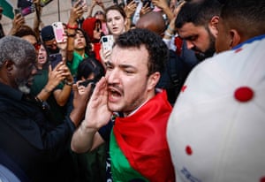 a man shouts in a crowd