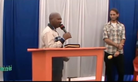Screenshot of a video posted on the YouTube channel of Paul Mackenzie’s Good News International Ministries, showing the unnamed ‘associate’ of A Voice in the Desert, right, at a church service in Makongeni on 12 May 2019