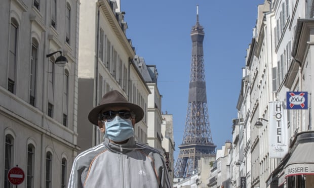 A man weaning a mask to protect against the spread of the coronavirus in Paris.