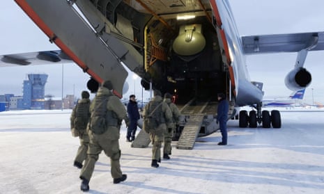 Russian airborne troops board an aircraft to join the Collective Security Treaty Organisation's peacekeeping force in Kazakhstan