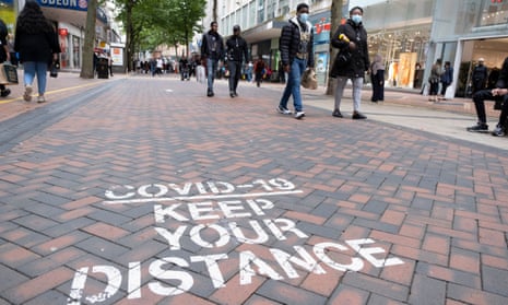 Social distancing sign on pavement in Birmingham