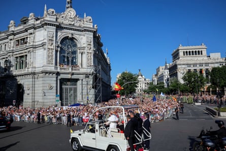 Pope Leo XIV rides on the popemobile through Madrid