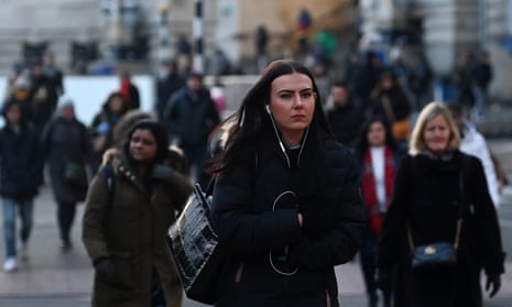 Commuters make their way to work in London