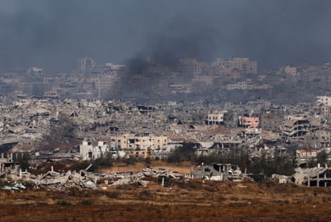 Smoke rises from northern Gaza, as seen from the Israeli side of the Israel-Gaza border on 21 May.