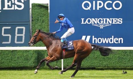 William Buick celebrates win the King George VI And Queen Elizabeth Stakes in style. 