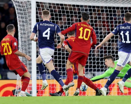 The Scotland midfielder Scott McTominay looks on as his shot beats the Spain goalkeeper, Kepa Arrizabalaga, during Scotland's 2-0 win in Euro 2024 qualifiying at Hampden Park.