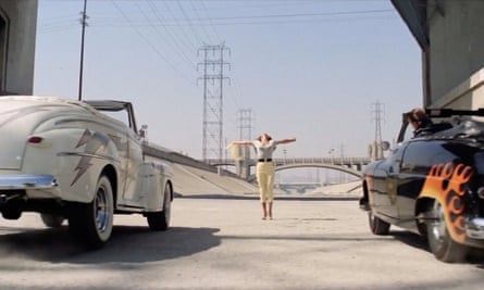 Better shape up … the big auto showdown in Grease began beneath LA’s beloved landmark.