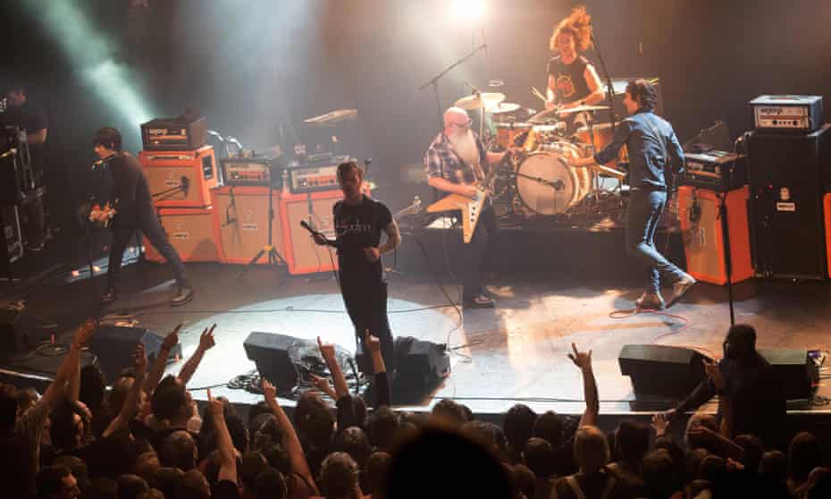 The Eagles of Death Metal on stage in November, minutes before gunmen opened fire and killed 90 people.