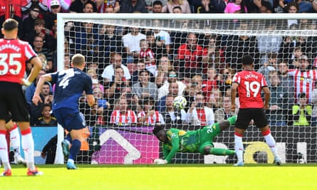 André Onana of Manchester United saves a penalty from Southampton’s Cameron Archer.