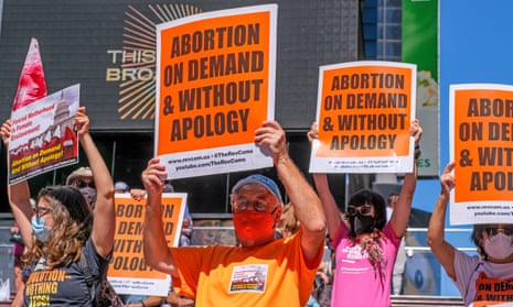 People hold signs protesting the anti-abortion law in Texas on 4 September.