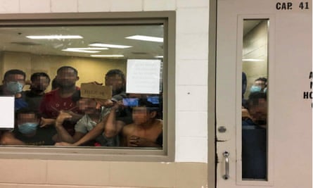 Men detained at a border patrol station in McAllen, Texas
